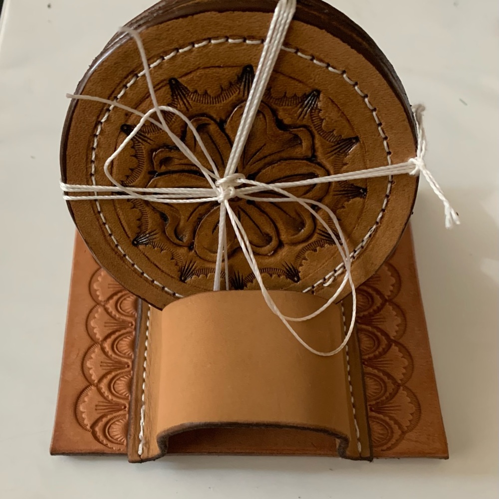 Tan tooled coaster set of 4.